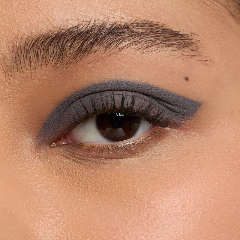 Macro eye shot of Mary Kay Matte Eye Shadow Stick in Moonshadow on medium skin tone