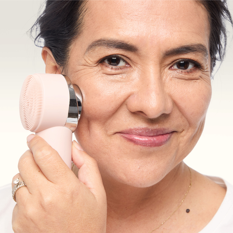 Model using the Thermal Massage side of the SpecialEdition Skinvigorate Duo Facial Device