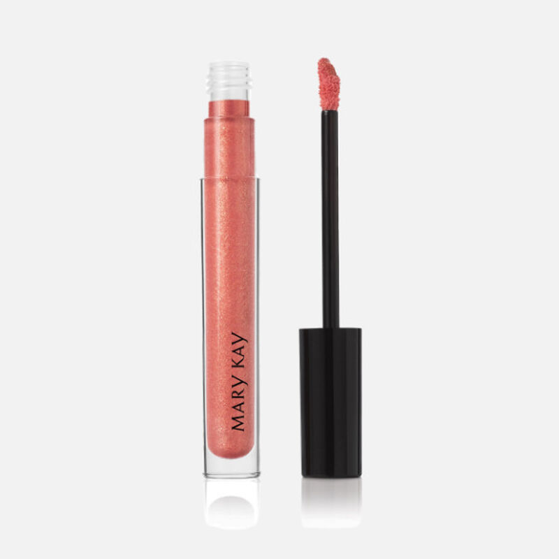 Open tube of Mary Kay Unlimited Lip Gloss in shade Fancy Nancy with accompanying applicator.