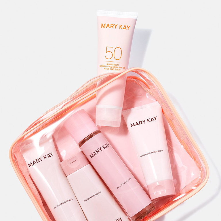 Mary Kay Skin Care set in pink bag with Mary Kay Sunscreen Broad Spectrum SF 50 Face and Body